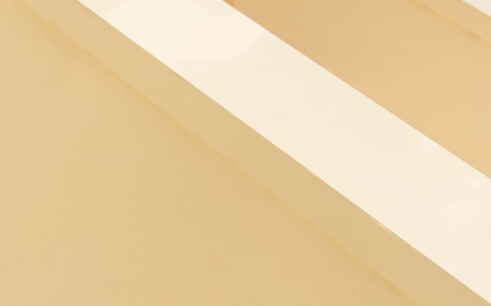 Smooth, paint-ready plaster in soft raking light